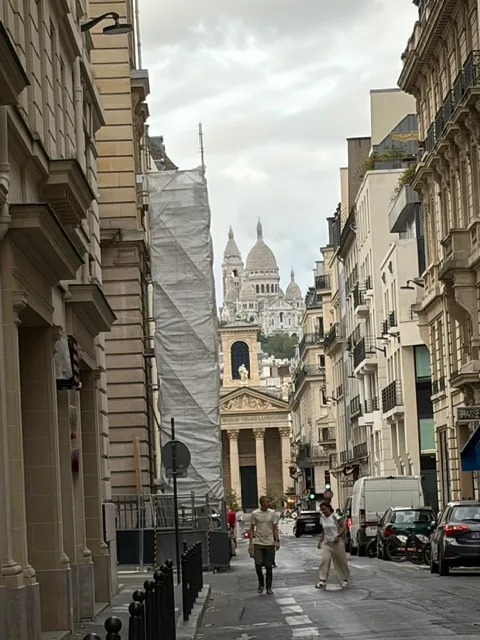 A Paris street with Sacré-Cœur at the end