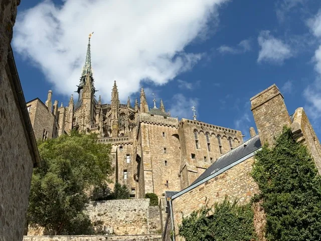 The abbey spire of Mont-Saint-Michel from below
