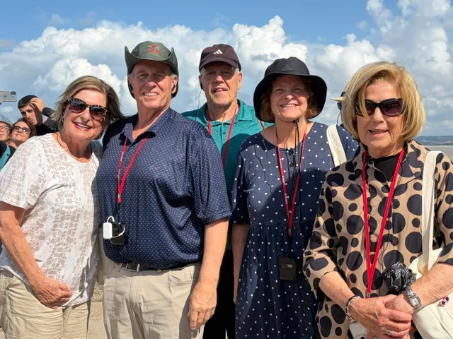 Five Travel Buddies in their lanyards at Mont-Saint-Michel