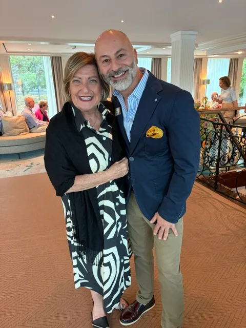Marsha with the cruise manager in the ship's lounge