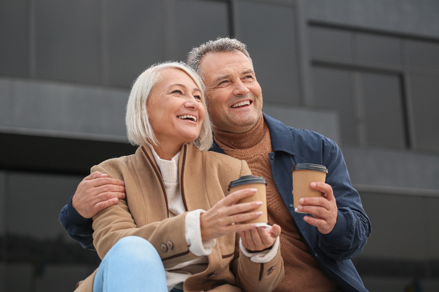 A couple laughing over coffee